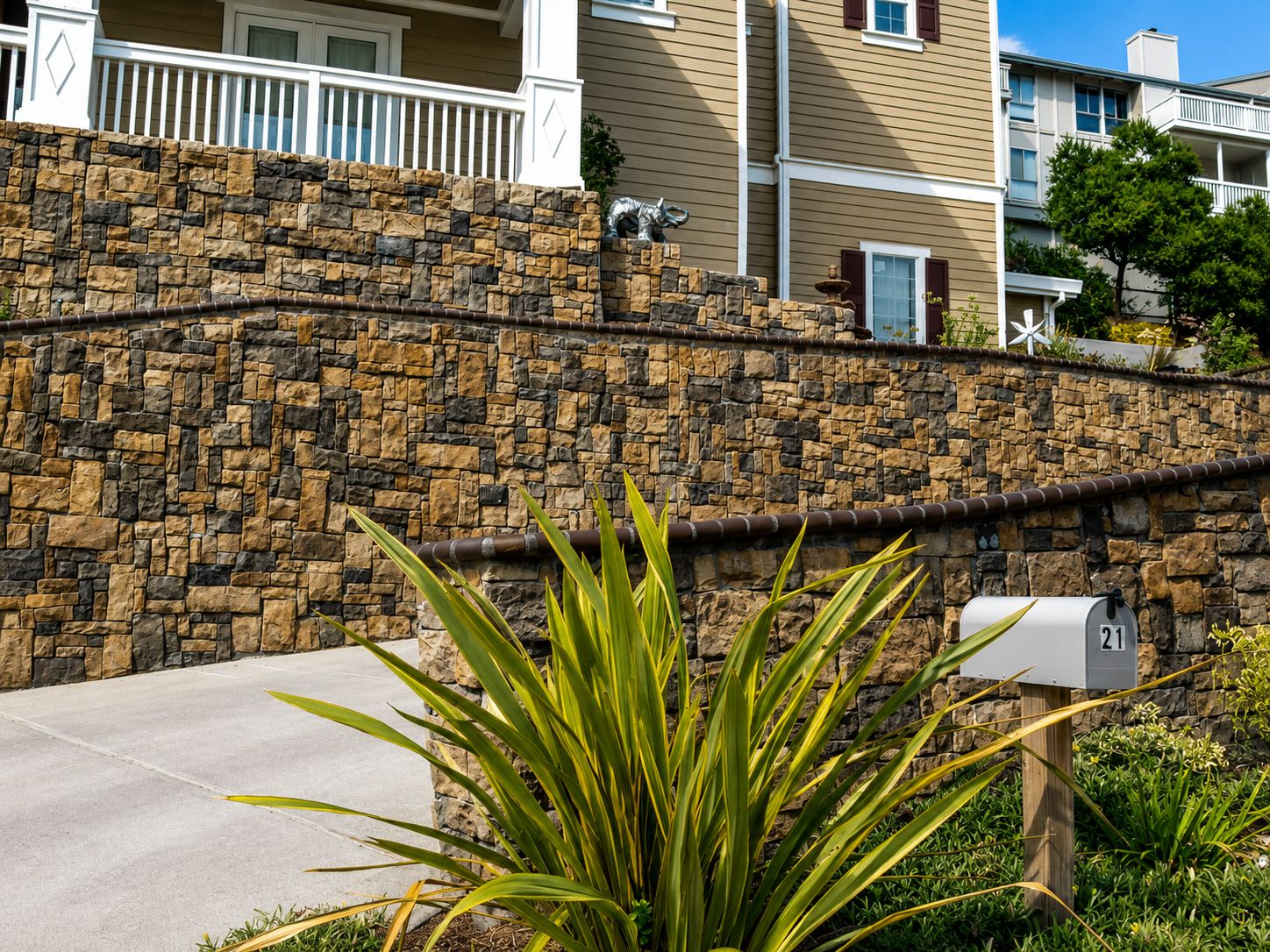 Tiered stone-veneer retaining wall with stepped landscaping on a San Ramon hillside
